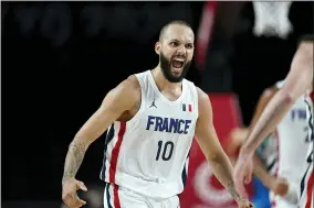  ?? CHARLIE NEIBERGALL — THE ASSOCIATED PRESS ?? France’s Evan Fournier (10) celebrates after making a 3-point basket during a men’s basketball semifinal round game against Slovenia at the 2020Summer Olympics, Thursday, Aug. 5, 2021, in Saitama, Japan.