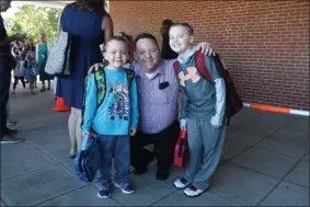  ?? LAUREN HALLIGAN - MEDIANEWS GROUP ?? Chad Jerome of Saratoga Springs send his kids Preston and Keaton to school on Thursday for their first days of second and third grade at Division Street Elementary School.