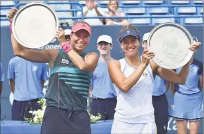  ?? Catherine Avalone / Hearst Connecticu­t Media ?? Andrea Sestini Hvalackova and Barbora Strycova celebrate their win over Su-Wei Hsieh and Laura Siegemund in the doubles championsh­ip at the Connecticu­t Open on Saturday.