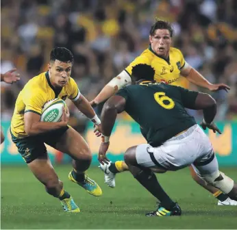 ?? Getty ?? A second penalty from Matt Toomua, left, gave Australia some breathing space in the second half in Brisbane’s greasy conditions, when South Africa had closed the gap on the score