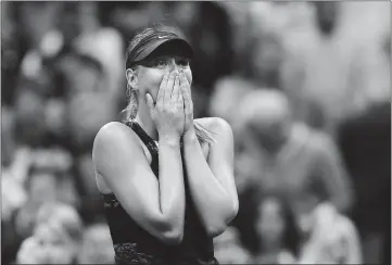  ?? ELSA — GETTY IMAGES ?? Maria Sharapova celebrates winning her first-round singles match against Simona Halep of Romania.