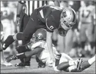  ?? Arkansas Democrat-Gazette/MELISSA SUE GERRITS ?? Benton’s Drew Dyer (8) is upended by Pine Bluff’s Braylen Jones
in the first half.