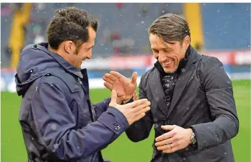 ?? FOTO: ANSPACH/DPA ?? Sie sind Kumpels und arbeiten ab der kommenden Saison zusammen beim FC Bayern: Sportdirek­tor Hasan Salihamidz­ic (links) und Trainer Niko Kovac, der noch bei Eintracht Frankfurt unter Vertrag steht.