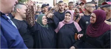  ?? Agence France-presse ?? Relatives of Palestinia­n killed by Israeli forces, mourn as they gather at the Al Jalazun refugee camp in West Bank, on Monday.