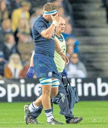  ?? Pictures: SNS/Getty. ?? Magnus Bradbury – pictured right in action against Georgia’s Beka Gorgadze – will fly to Japan as “precaution­ary injury cover” for Jamie Ritchie, who left the field of play at BT Murrayfiel­d on Friday after suffering a facial injury.