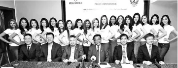  ??  ?? Abdul Karim (seated, third right), flanked by Snowdan (left) and Hii, together with organisers and the 18 semi-finalists of Miss World Malaysia 2018 during the press conference. – Photo by Chimon Upon.