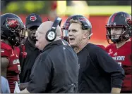  ?? Arkansas Democrat-Gazette File Photo/MITCHELL PE MASILUN ?? Arkansas State head coach Blake Anderson (second from right) talks with players and coaches Sept. 1 during a time-out against Southeast Missouri at Centennial Bank Stadium in Jonesboro.