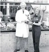  ??  ?? Pat is handed a window dressing trophy as part of the 1977 Silver Jubilee celebratio­ns.