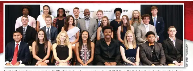  ??  ?? Emmitt Smith, former Cowboys running back and the NFL’s all-time leading rusher, center, back row, along with CHI St. Vincent CEO Chad Aduddell, right of center, pose with the Arkansas
Democrat-Gazette’s All-Arkansas Preps award winners. The honorees...