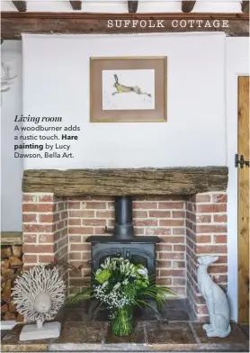 ??  ?? Living roomA woodburner adds a rustic touch. Hare painting by Lucy Dawson, Bella Art.