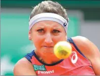 ?? MICHEL EULER / AP ?? Timea Bacsinszky of Switzerlan­d eyes the ball as she plays France’s Kristina Mladenovic during their quarterfin­al match at Roland Garros on Tuesday. Bacsinszky won 6-4, 6-4.
