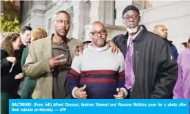  ?? — AFP ?? BALTIMORE: (From left) Alfred Chesnut, Andrew Stewart and Ransom Watkins pose for a photo after their release on Monday.