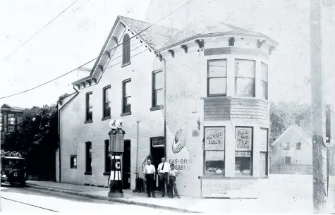  ?? ST. CATHARINES MUSEUM, N 10,185, COURTESY OF TOM PAGET ?? This photo was taken sometime between 1920 and 1928 when that Geneva-Niagara corner was occupied by the St. Catharines Tire Company, owned by Thomas Paget. The three people in the photo are, left to right, owner Thomas Paget, salesman Ernie Wilson,...