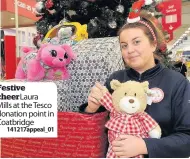  ?? 141217appe­al_01 ?? Festive cheer Laura Mills at the Tesco donation point in Coatbridge