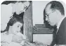  ??  ?? Dr. Salk gives a girl the polio vaccine shot in 1956.