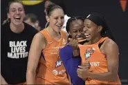  ?? PHELAN M. EBENHACK - THE ASSOCIATED PRESS ?? Phoenix Mercury guard Shey Peddy, right, is congratula­ted by guard Shatori Walker-Kimbrough, second from right, guard Diana Taurasi and forward Alanna Smith, left, after Peddy hit the game-winning shot as time expired against the Washington Mystics on Sept. 15.