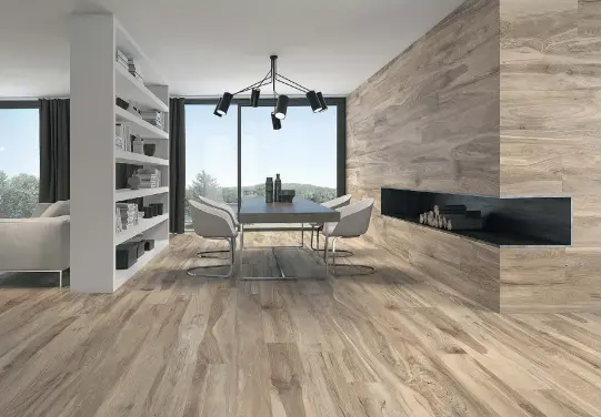  ??  ?? Ceramic tiles have made their way from the kitchen and bathroom areas into the living and dining rooms, and not just as flooring but also as wall decor. Here, Sonora tiles in a natural woodgrain pattern serve to unify the living spaces as well as...