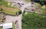  ?? OMNIA DMP/FILE ?? The aerial photo shows cranes, other vehicles and equipment stored at a former quarry at 850 Route 28 in the town of Kingston, N.Y.