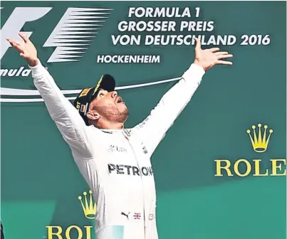  ??  ?? Lewis Hamilton celebrates victory at Hockenheim, his sixth win in seven races.