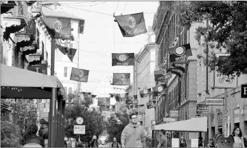  ??  ?? Flags of Italian football clubs Inter Milan and AC Milan are hanged in the Paolo Sarpi street, a Chinese neighbourh­ood of Milan, Italy. — AFP photo