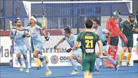  ?? ARABINDA MAHAPATRA/HT PHOTO ?? Mandeep Singh (2nd from left) is over the moon after scoring India’s first goal against South Africa at Bhubaneswa­r’s Kalinga Stadium on Wednesday.