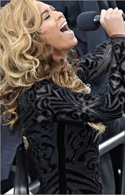  ??  ?? PRETTY CONVINCING: Beyoncé ‘singing’ at Obama’s inaugurati­on