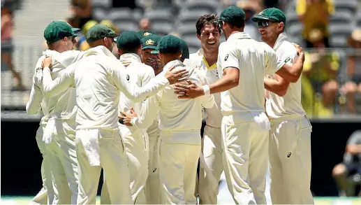  ?? GETTY IMAGES ?? Australian players celebrate the fall of the final wicket that sealed their win over India in the second test.