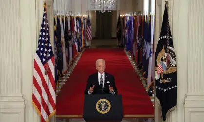  ?? Photograph: Alex Wong/Getty Images ?? President Joe Biden gives a primetime address to the nation from the East Room of the White House on 11 March 2021.