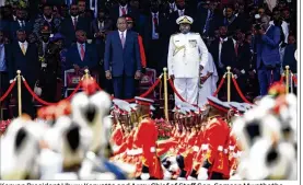  ?? SAYYID ABDUL AZIM / ASSOCIATED PRESS ?? Kenyan President Uhuru Kenyatta and Army Chief of Staff Gen. Samson Mwathethe (right) watch as armed forces of the Republic of Kenya march during Kenyatta’s inaugurati­on ceremony in Nairobi, Kenya on Tuesday.