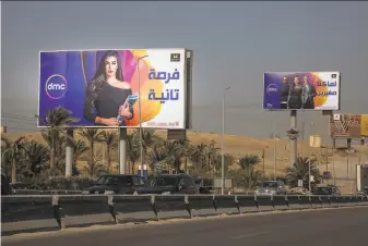  ?? Sima Diab / New York Times ?? Billboards advertise a popular TV series along a highway in Cairo. The government censors the scripts of the program that Egyptians are lapping up during the holy month of Ramadan.