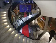  ?? (AP/Jean-Francois Badias) ?? A man walks down stairs Monday during a special session on lobbying at the European Parliament in Strasbourg, eastern France.