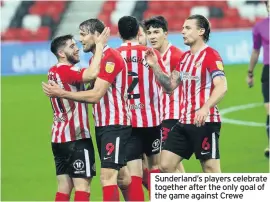  ??  ?? Sunderland’s players celebrate together after the only goal of the game against Crewe