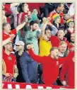  ??  ?? PLENTY TO SHOUT ABOUT Wales fans celebrate in Georgia