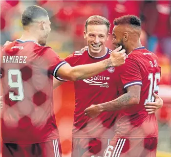  ??  ?? Lewis Ferguson is congratula­ted after scoring his second goal against Hacken.