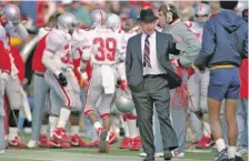  ?? THE ASSOCIATED PRESS FILE PHOTO ?? Ohio State football coach Earle Bruce gestures from the sideline during the Buckeyes’ game at Michigan in November 1987. Bruce died in Columbus, Ohio, on Friday at the age of 87. He had Alzheimer’s disease.