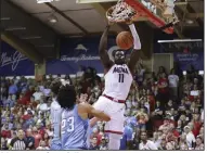  ?? (AP/Marco Garcia) ?? Arizona center Oumar Ballo (11) dunks the ball Wednesday during the second half of the No. 14 Wildcats’ 81-79 victory over No. 10 Creighton in the championsh­ip game of the Maui Invitation­al in Lahaina, Hawaii. Ballo finished with 30 points and 13 rebounds.