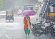  ?? VIJAY BATE/HT ?? A woman walks in rain at Thakur Village, Kandivli, on Sunday. The city is under ‘green’ category alert till Aug 19, indicating chances of light to moderate rain at isolated spots.