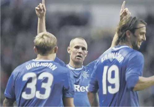  ??  ?? Kenny Miller celebrates his goal with team-mates Martyn Waghorn and Niko Kranjcar but it is all Rangers have to take to Luxembourg.
