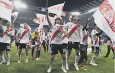  ??  ?? 0 River Plate players celebrate their victory at the Bernabeu.