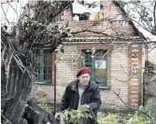  ?? ANDRIY ANDRIYENKO AP ?? Vladimir Semenets, 84, stands in front of his damaged house in the retaken village of Bohorodych­ne, eastern Ukraine, on Saturday.