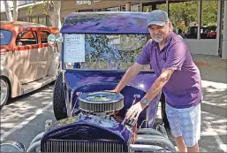  ??  ?? Plumas Lake resident Danny Martinez, 70, shows off his 2008 Spirit Industries C-Cab, which is a remake of the 1923 model, on Saturday.