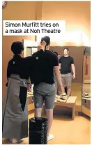  ??  ?? Simon Murfitt tries on a mask at Noh Theatre