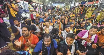  ?? PTI ?? Devotees stage Namajapa protest against the police restrictio­ns at Sannidhana­m in Sabarimala on Sunday. The devotees were reportedly refused permission to halt at Malikappur­am.