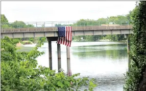  ?? MEGAN DAVIS/MCDONALD COUNTY PRESS ?? The city of Noel displayed an American flag from the north bridge over the Memorial Day weekend last year.