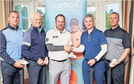  ?? ?? Shake on it Ritchie Ramsay, centre left, with winning team members Mark Blyth, who also won the longest drive competitio­n, Sandy Conner, Mark Christie and Jim Dickson. Pic: Fraser Band