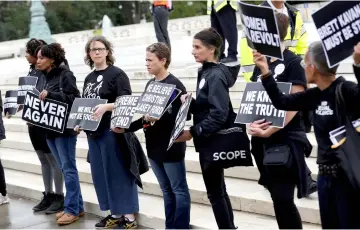  ??  ?? Demonstrat­ors protest against Kavanaugh in front of the Supreme Court in Washington. — Reuters photo