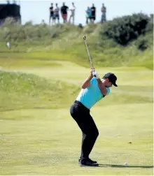  ?? GREGORY SHAMUS/GETTY IMAGES ?? Jason Day hits his second shot on the 10th hole during a Wednesday practice round ahead of the 146th Open Championsh­ip at Royal Birkdale in Southport, England.