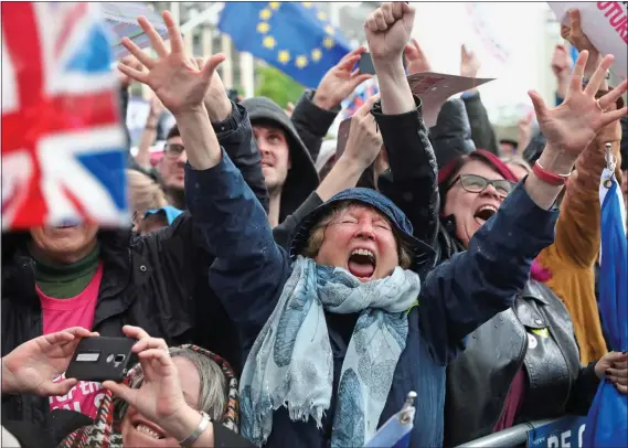  ??  ?? JUBILATION: People’s Vote marchers in Central London celebrate as news of the Letwin vote comes through. Left: Actors Paul McGann and Sir Patrick Stewart