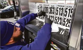  ?? Christian Abraham / Hearst Connecticu­t Media ?? Joseph Parente changes the prices at the pump at Soundview Servicente­r North in Old Greenwich. The state’s gas tax holiday brings prices down 25 cents per gallon.