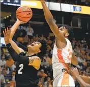  ?? John Amis Associated Press ?? KJ SIMPSON of Colorado had 23 points and 10 rebounds against Josiah-Jordan James and Tennessee.